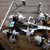 Crew members of Mercedes Formula One driver Rosberg of Germany service the car at pit stop during the Spanish F1 Grand Prix at the Barcelona-Catalunya Circuit in Montmelo