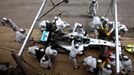 Crew members of Mercedes Formula One driver Nico Rosberg of Germany service the car at pit stop during the Spanish F1 Grand Prix at the Barcelona-Catalunya Circuit in Mon