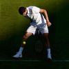 Grigor Dimitrov of Bulgaria plays a shot through his legs during his match against Federico Delbonis of Argentina at the Wimbledon Tennis Championships in London