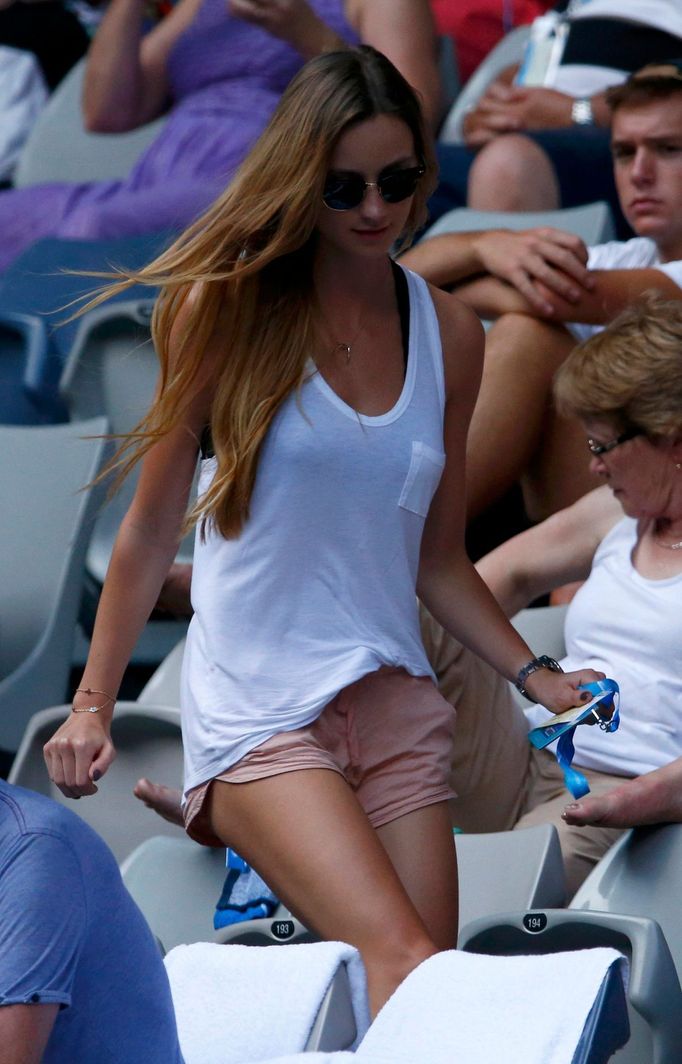 Ester Satorova, the girlfriend of Tomas Berdych of Czech Republic, returns to her seat during her men's singles match at the Australian Open 2014 tennis tournament in Mel