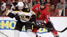 Boston Bruins right wing Jaromir Jagr (68) is checked by Chicago Blackhawks left wing Brandon Bollig (52) in double-overtime during Game 1 of their NHL Stanley Cup Finals