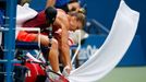 Simona Halep of Romania reacts during a break in play after losing a game to Flavia Pennetta of Italy in their women's singles semi-final match at the U.S. Open Champions