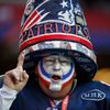 A New England Patriots fan celebrates while awaiting the start of the NFL Super Bowl XLIX football game against the Seattle Seahawks in Glendale