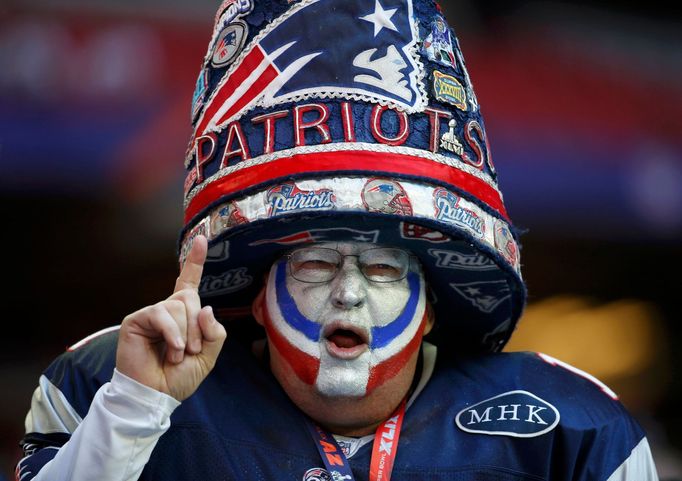 A New England Patriots fan celebrates while awaiting the start of the NFL Super Bowl XLIX football game against the Seattle Seahawks in Glendale, Arizona February 1, 2015