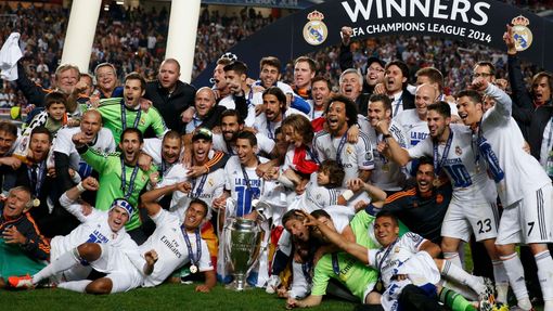 Real Madrid's players and officials celebrate with the trophy after defeating Atletico Madrid in the their Champions League final soccer match at the Luz Stadium in Lisbo