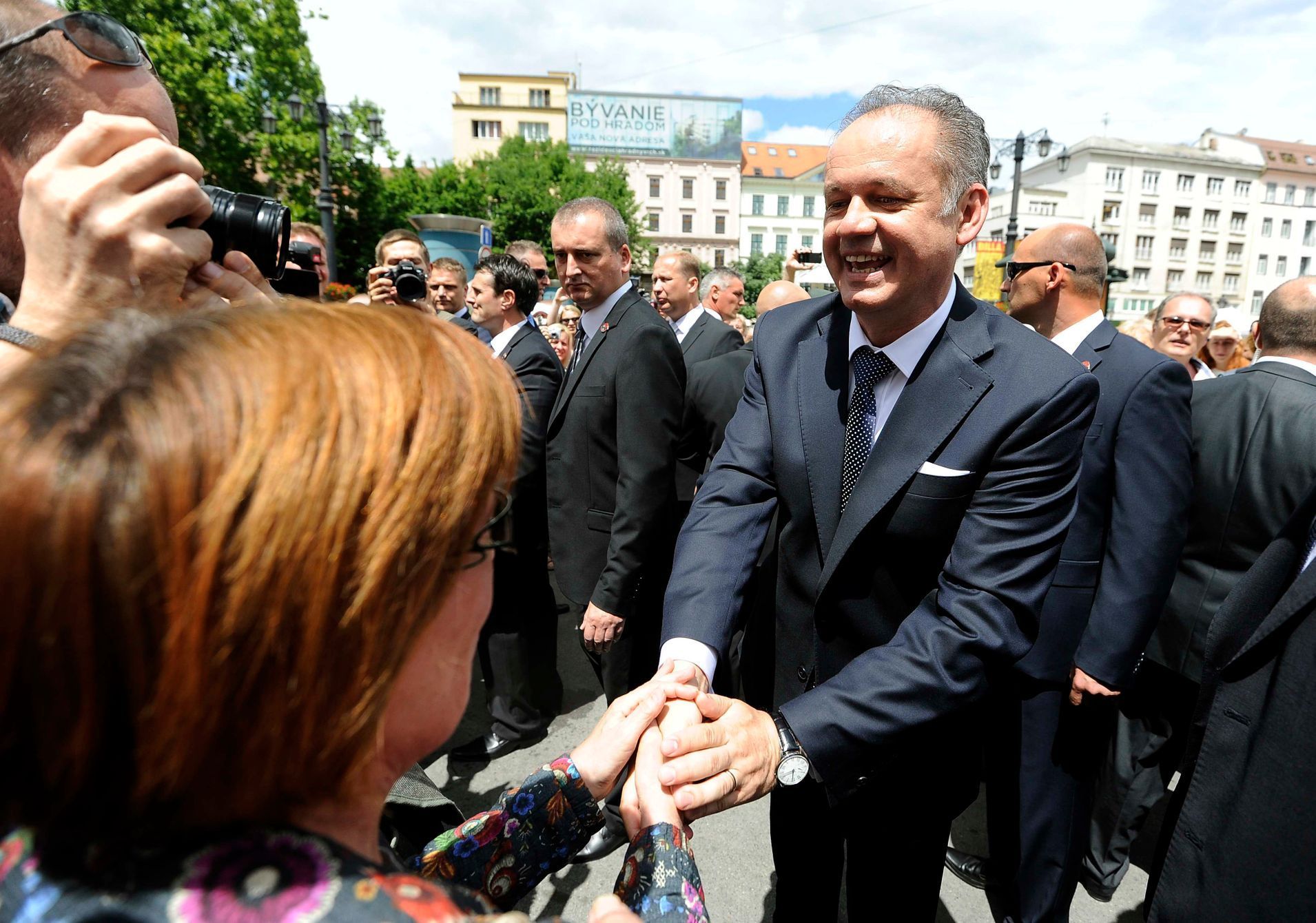 Slovakia's President Andrej Kiska shakes hands with a woman after his swearing-in ceremony in Bratislava