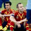 Spain's Iniesta and Pedro sit on the field after losing thei
