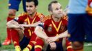 Spain's Andres Iniesta (R) and Pedro sit on the field after losing their Confederations Cup final soccer match to Brazil at the Estadio Maracana in Rio de Janeiro June 30