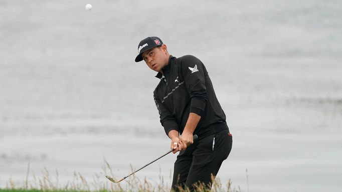 Jun 14, 2019; Pebble Beach, CA, USA; Gary Woodland hits a chip shot on the eighth hole during the second round of the 2019 U.S. Open golf tournament at Pebble Beach Golf