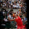 Eugenie Bouchard of Canada serves to Carla Suarez Navarro of Spain during their women's quarter-final match at the French Open Tennis tournament at the Roland Garros stadium in Paris