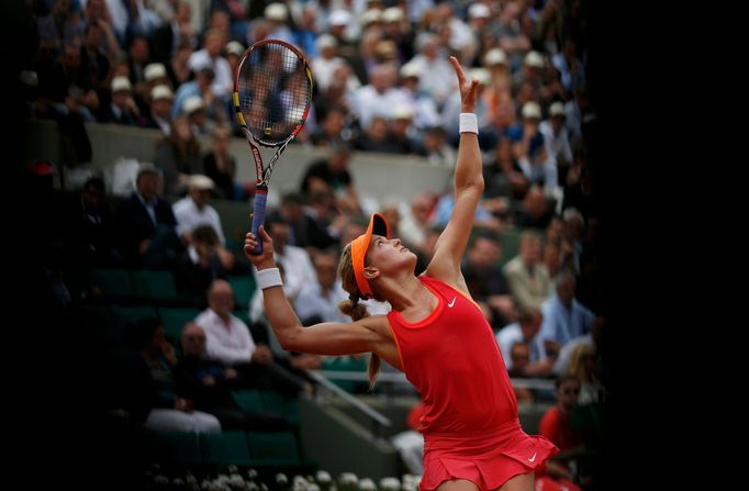 Eugenie Bouchard of Canada serves to Carla Suarez Navarro of Spain during their women's quarter-final match at the French Open Tennis tournament at the Roland Garros stad