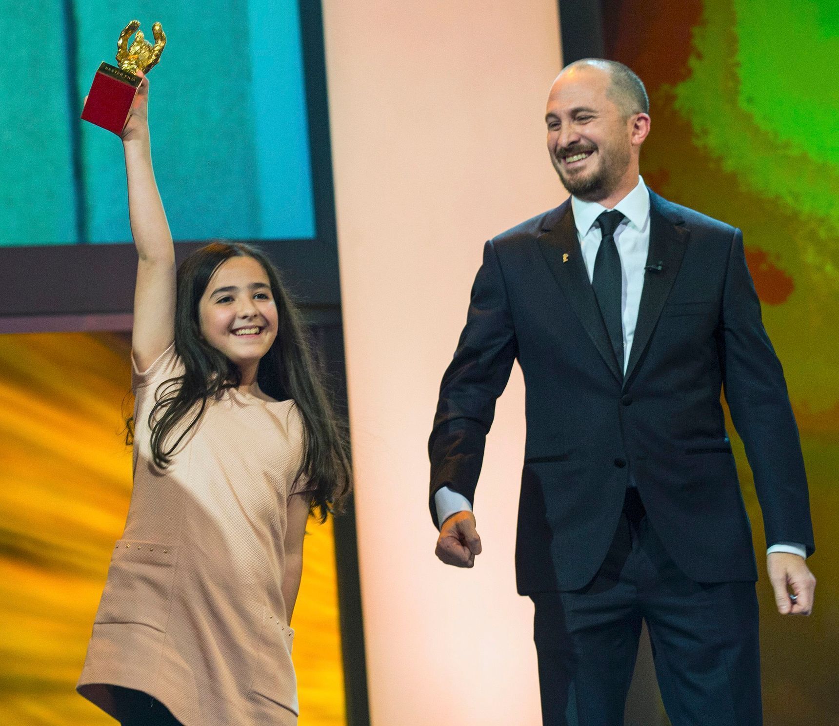 The niece of Iranian film director Panahi accepts the Golden Bear for Best Film on her uncle's behalf during awards ceremony at 65th Berlinale International Film Festival in Berlin