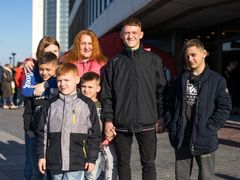 Iryna, Bohdan and four brothers with their mother.