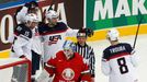 Brock Nelson of the U.S. (top) celebrates his goal with team mates Craig Smith (15), Jacob Trouba (8) and Tyler Johnson (9) as goalkeeper Andrei Mezin of Belarus looks on