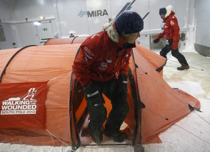 Britain's Prince Harry leaves his tent during a cold chamber training exercise with the Walking with the Wounded South Pole Allied Challenge 2013 British team at Nuneaton in central England.