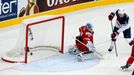 Brock Nelson of the U.S. scores past by goalkeeper Andrei Mezin of Belarus during the first period of their men's ice hockey World Championship Group B game at Minsk Aren