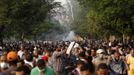 Members of the Muslim Brotherhood and supporters of ousted Egyptian President Mohamed Mursi run from tear gas released by riot police during clashes along a road at Kornish El Nile which leads to Tahrir Square during a celebration commemorating Egypt's 1973 war with Israel in Cairo October 6, 2013. Thousands of supporters of deposed Egyptian President Mohamed Mursi marched through Cairo on Sunday towards Tahrir Square, where pro-army supporters gathered to celebrate the anniversary of an attack on Israeli forces in 1973.