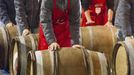 Men roll barrels of Beaujolais Nouveau wine for the official launch of the 2012 vintage in the center of Lyon early November 15, 2012. REUTERS/Robert Pratta (FRANCE - Tags: SOCIETY) Published: Lis. 15, 2012, 2:13 dop.