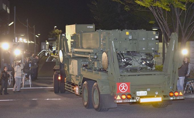 TOKYO, Japan - A Patriot Advanced Capability-3 missile interceptor unit is brought to the premises of the Defense Ministry in Tokyo in the early hours of April 9, 2013, to prepare for a possible ballistic missile launch by North Korea.