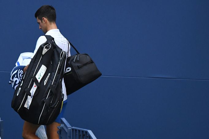 Sep 6, 2020; Flushing Meadows, New York, USA; Novak Djokovic of Serbia leaves the court after being defaulted for striking a lines person with a ball against Pablo Carren