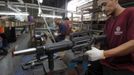 A former illegal gunsmith inspects a newly assembled multi-action shotgun at Shooters Arms, a gun manufacturing company exporting different kinds of weapons to other countries, in Cebu city in central Philippines July 7, 2012. In the Philippines, they vote with their trigger fingers. Elections mean big business for illegal gunsmiths, who are looking forward to 2013 mid-term polls. With election-related violence commonplace, the Philippines imposes a ban on the carrying of guns for six months, from campaigning to the proclamation of winners. Picture taken July 7, 2012. To match Feature PHILIPPINES-GUNS/ REUTERS/Erik De Castro (PHILIPPINES - Tags: SOCIETY POLITICS BUSINESS CRIME LAW) Published: Čec. 29, 2012, 1:55 dop.