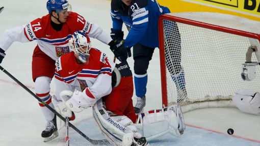 Finland's Jori Lehtera scores a goal against against goalie Alexander Salak (C) of the Czech Republic during their men's ice hockey World Championship semi-final game at