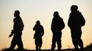 Israeli soldiers stand at their base just outside the central Gaza Strip November 15, 2012. A Hamas rocket killed three Israelis north of the Gaza Strip on Thursday, drawing the first blood from Israel as the Palestinian death toll rose to 15 in a military showdown lurching closer to all-out war and an invasion of the enclave. REUTERS/Amir Cohen (ISRAEL - Tags: POLITICS CIVIL UNREST) Published: Lis. 15, 2012, 4:41 odp.