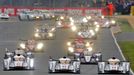 The Audi R18 E-Tron Quattro drivers Andre Lotterer of Germany (1), Britain Allan McNish (2) and Lucas Di Grassi of Brazil (3) drive just ahead of the Toyota TS030 Hybrid