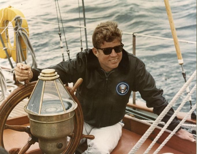 Former United States President John F. Kennedy sits onboard the U.S. Coast Guard yacht Manitou off the coast of Maine, in this handout image taken on August 12, 1962.