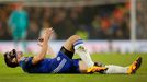 Chelsea's Cesar Azpilicueta lies on the pitch after sustaining an injury