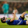Chelsea's Cesar Azpilicueta lies on the pitch after sustaining an injury