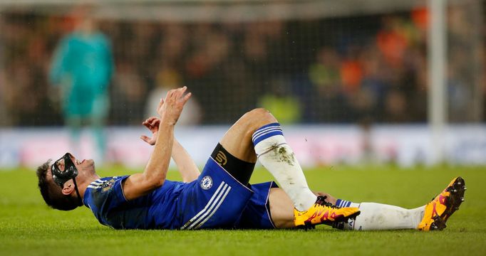 Chelsea's Cesar Azpilicueta lies on the pitch after sustaining an injury