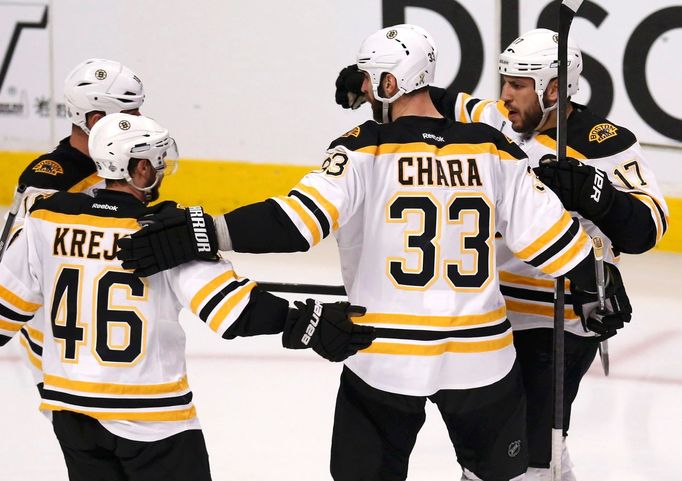 Boston Bruins' Milan Lucic (R) celebrates his second goal on the Chicago Blackhawks with teammates Zdeno Chara (33), David Krejci (46) and Nathan Horton during the second