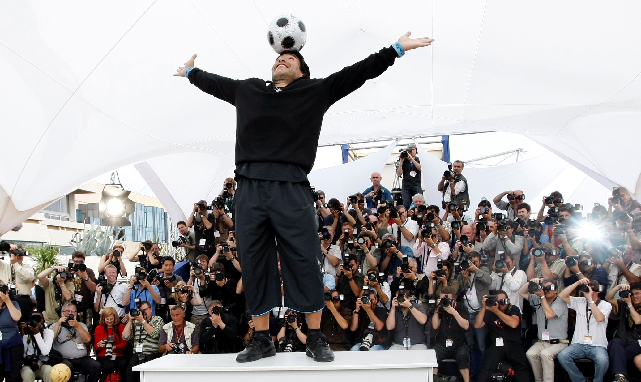 FILE PHOTO: Argentine great Diego Maradona balances a ball on his head during an event at the 61st Cannes Film Festival on the French Riviera