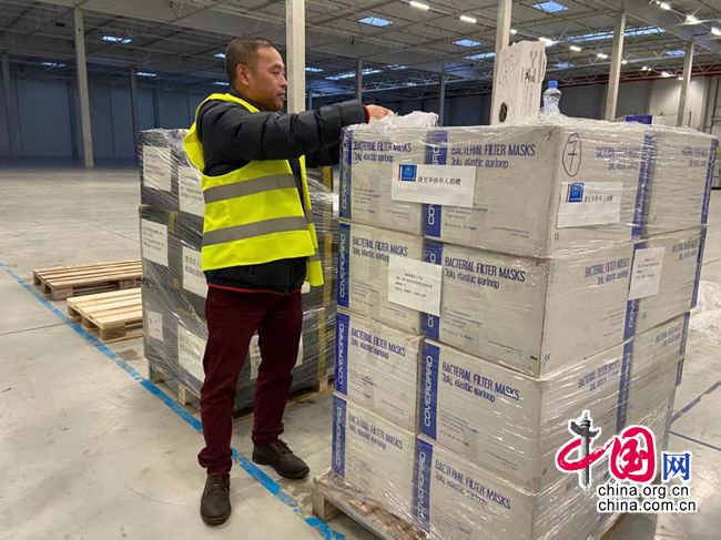 Czech Chinese Youth Association president Zong Weiyong packs surgical masks to be shipped to China.