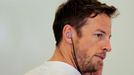 McLaren Formula One driver Jenson Button of Britain looks on during the first practice session of the Bahrain F1 Grand Prix at the Bahrain International Circuit (BIC) in