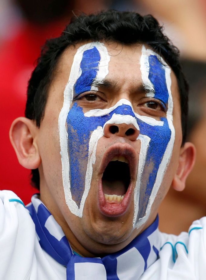 A Honduras fan cheers before the start of the 2014 World Cup Group E soccer match between France and Honduras at the Beira-Rio stadium in Porto Alegre June 15, 2014. REUT