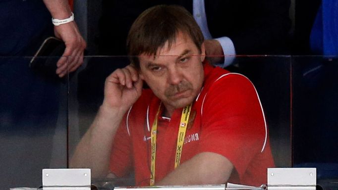 Russia head coach Oleg Znarok sits in the public area before his team's men's ice hockey World Championship final game against Finland at Minsk Arena in Minsk May 25, 201