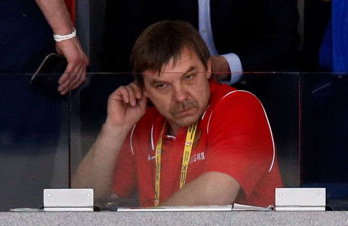 Russia head coach Oleg Znarok sits in the public area before his team's men's ice hockey World Championship final game against Finland at Minsk Arena in Minsk May 25, 201