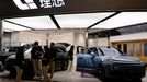 FILE PHOTO: Staff members stand at the booth of Chinese electric vehicle (EV) maker Li Auto, at a shopping mall in Beijing, China November 3, 2023. REUTERS/Tingshu Wang/F