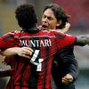 AC Milan's Muntari celebrates with his coach Inzaghi after scoring goal against Lazio  during their Italian Serie A match in Milan