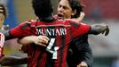 AC Milan's Muntari celebrates with his coach Inzaghi after scoring goal against Lazio  during their Italian Serie A match in Milan