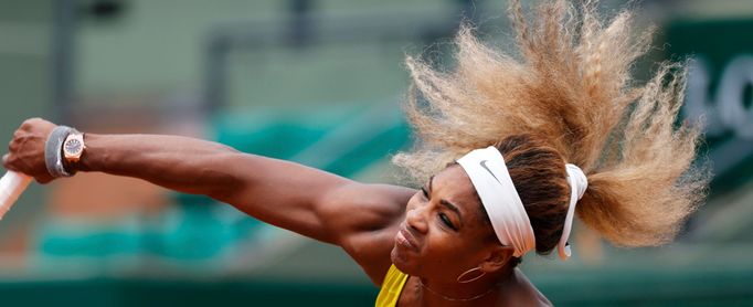 Serena Williams of the U.S. competes in a women's singles match against Garbine Muguruza of Spain at the French Open tennis tournament at the Roland Garros stadium in Par