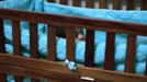 A baby stands in a crib in a bedroom of the San Jose Hospice, in Sacatepequez, 45 km (28 miles) of Guatemala City, November 30, 2012. About 68 HIV-infected children receive free medical care at the hospice, many of them were found abandoned in markets, churches, fire stations, left neglected in hospitals or in some instances, brought in by their families who cannot afford to pay for their medical treatment. World AIDS Day which falls on December 1 is commemorated across the world to raise awareness of the pandemic. REUTERS/Jorge Dan Lopez (GUATEMALA - Tags: ANNIVERSARY HEALTH) Published: Pro. 1, 2012, 2 dop.