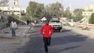 Somali athlete Mohamed Hassan Mohamed runs along a street as he trains during preparations for the 2012 London Olympic Games in Somalia's capital Mogadishu in this March 14, 2012 file photo. Training in a bullet-riddled stadium where the remains of a rocket propelled grenade lies discarded on the track's edge counts as progress for Somali Olympic hopeful Mohamed Hassan Mohamed. A year ago, Mogadishu's Konis stadium was a base for Islamist militants and a work out meant at times running through the streets, dodging gun-fire and mortar shells in one of the world's most dangerous cities. Picture taken March 14, 2012. To match OLY-SOMALIA-HOPES/ REUTERS/Feisal Omar/Files (SOMALIA - Tags: SPORT ATHLETICS SOCIETY OLYMPICS) Published: Čer. 11, 2012, 7:12 dop.