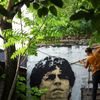 An artist paints a mural of soccer legend Diego Maradona on a wall of the house where Maradona spent his childhood on the outskirts of  Buenos Aires