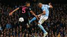 Manchester City's Fernando heads at goal as PSG's Marquinhos looks on