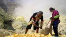 Sulfur miners risk health on Mount Ijen Jakarta, Indonesia. 24th October 2012 -- Sulfur miners break sulfur with a hammer so they can easily carry it from Mt. Kawah Ijen.