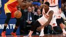 Houston Rockets guard James Harden (13) and New York Knicks forward Cleanthony Early (17) battle for a loose ball as Knicks forward Jason Smith (14) defends.