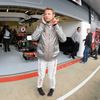 McLaren Formula One driver Button watches from pit lane duri
